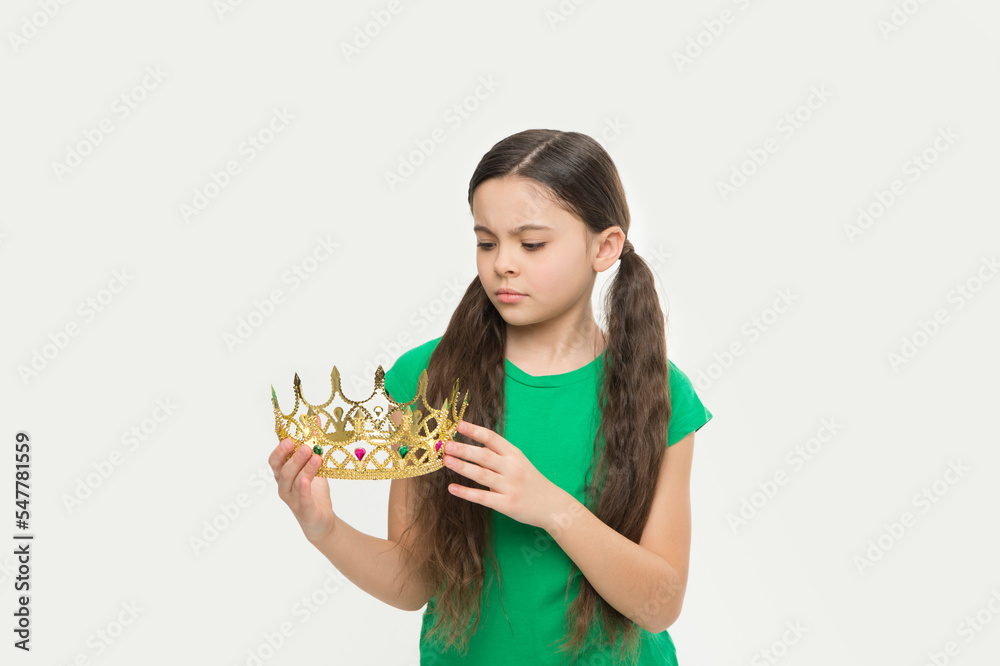 real royal crown. she is prom queen. little beauty in princess crown. small girl egoist isolated on white. Source of pride. childhood happiness. jewel accessory shop. we have a winner real royal crown. she is prom queen. little beauty in princess crown. small girl egoist isolated on white. Source of pride. childhood happiness. jewel accessory shop. we have a winner