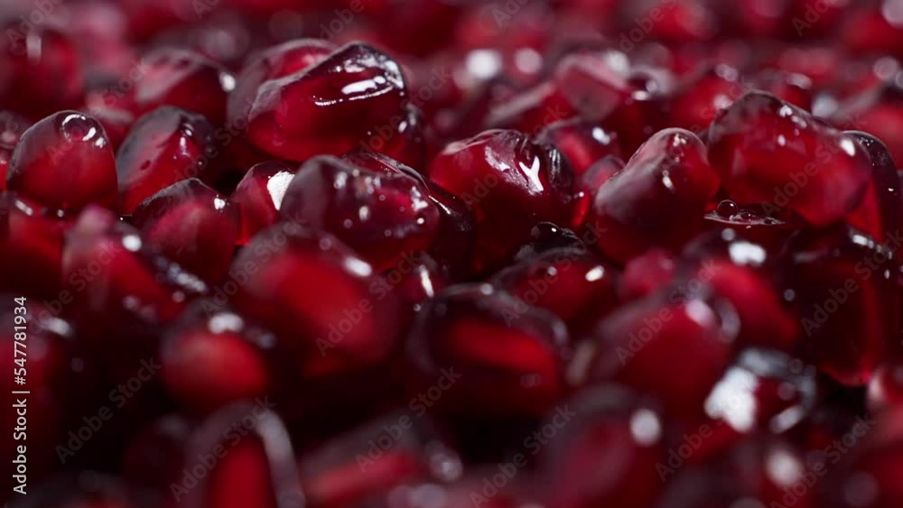 Macro photography of bright red pomegranate fruit seeds. Rotating red ripe pomegranate. High quality 4k footage Macro photography of bright red pomegranate fruit seeds. Rotating red ripe pomegranate. High quality 4k footage