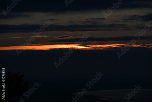 A glimmering spectacle in the silhouette of the sunrise morning glow. Natural background material.