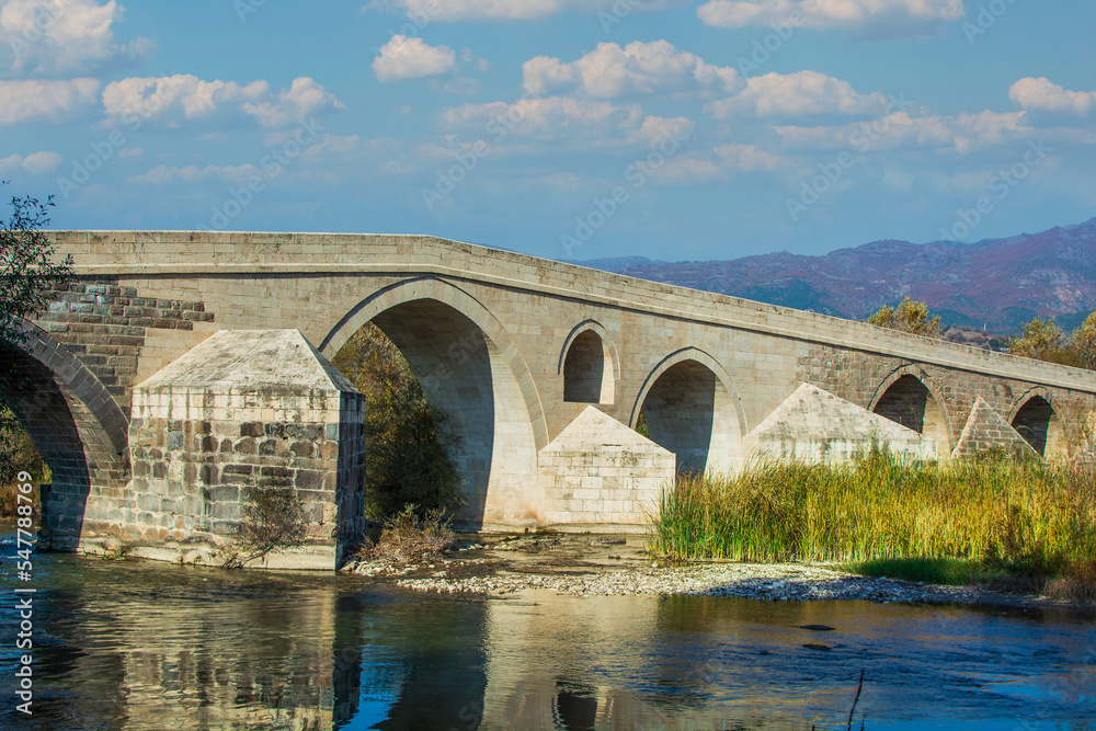 Historical Talazan Bridge. It is 15 km from the town of Niksar. Ottoman bridge over Kelkit Stream. Tokat, Turkey	