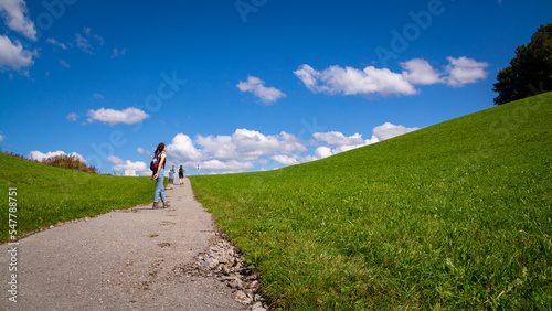 Girl walking in nature. Alpenwildpark Pfänder, Bregenz, Austria photo