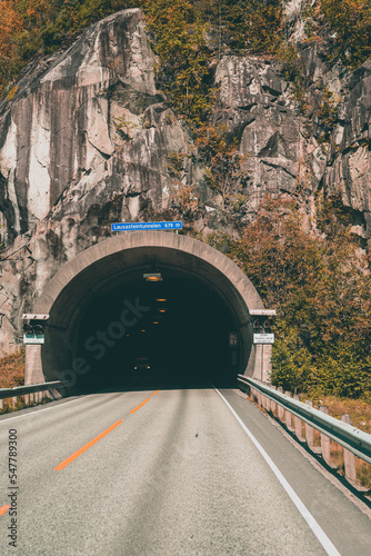 A tunnel entrance in Norway with a beautiful mountain 