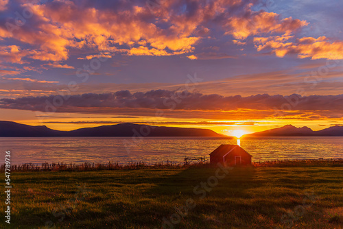 Sunset over old boathouse in Lyngen, Norway. 