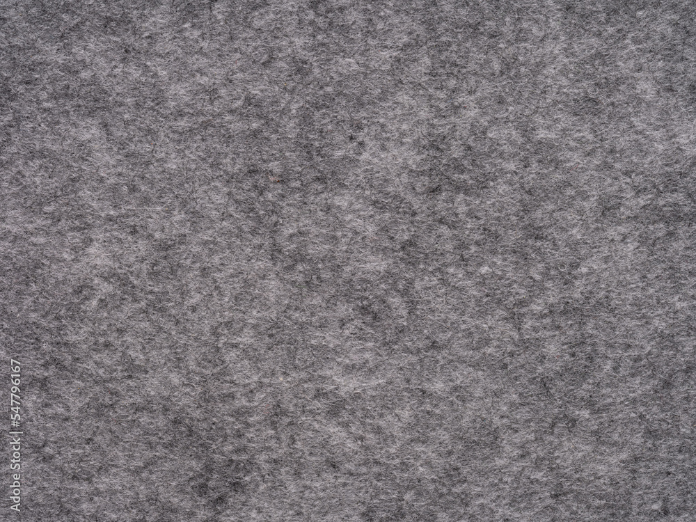 Soft grey felt. Surface of felted fabric texture abstract background in gray color. Pattern for text, lettering, patchworkor other art work. Full frame backdrop wallpaper. High resolution photo.
