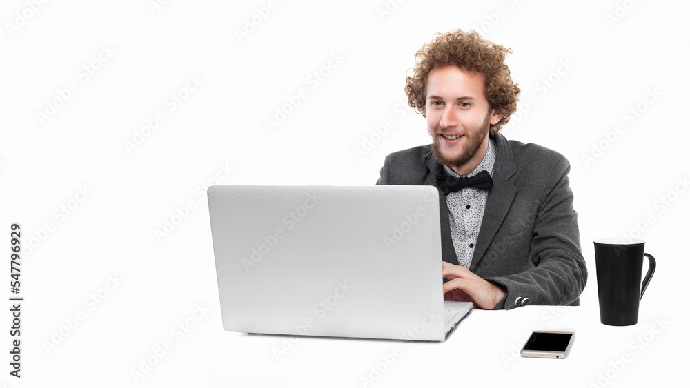 Portrait of funny businessman with bow tie who sitting and using laptop isolated on white background Portrait of funny businessman with bow tie who sitting and using laptop isolated on white background