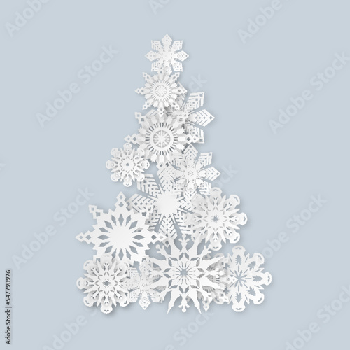 Christmas tree symbol from realistic paper snowflakes. Snow starts elements for winter holiday decor