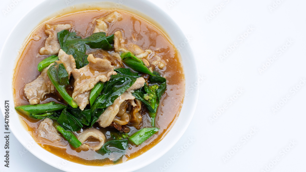 Fried flat noodle with pork and kale in gravy sauce Fried flat noodle with pork and kale in gravy sauce
