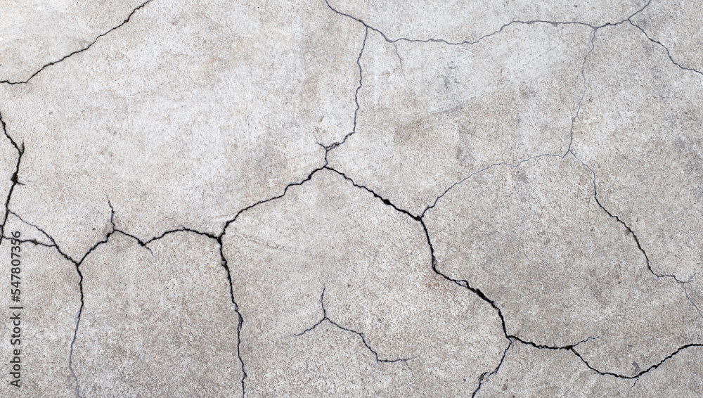 Cracked cement or concrete surface texture for background. Cracked cement or concrete surface texture for background.