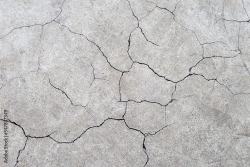 Cracked cement or concrete surface texture for background.
