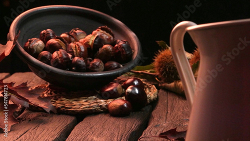 Roasted chestnuts and leaves photo