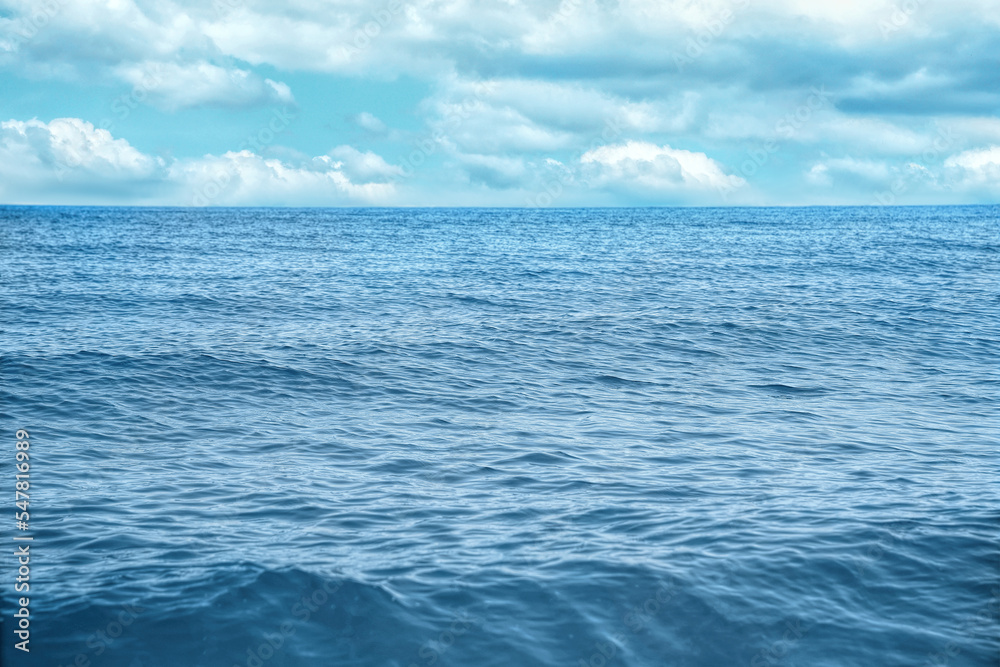 Beautiful view of seascape and blue sky with white clouds on sunny day