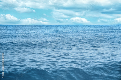 Beautiful view of seascape and blue sky with white clouds on sunny day © New Africa