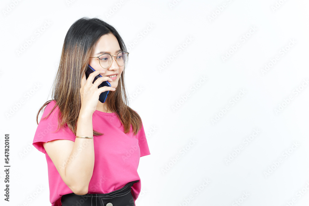 Talking on the smartphone with Happy face Of Beautiful Asian Woman Isolated On White Background Talking on the smartphone with Happy face Of Beautiful Asian Woman Isolated On White Background