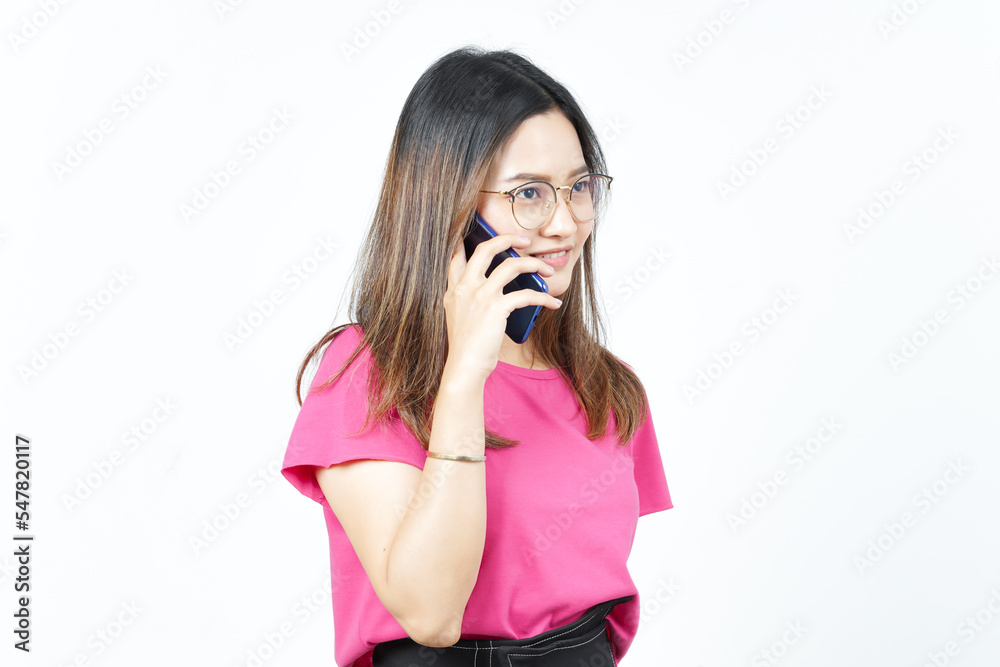 Talking on the smartphone with Happy face Of Beautiful Asian Woman Isolated On White Background Talking on the smartphone with Happy face Of Beautiful Asian Woman Isolated On White Background