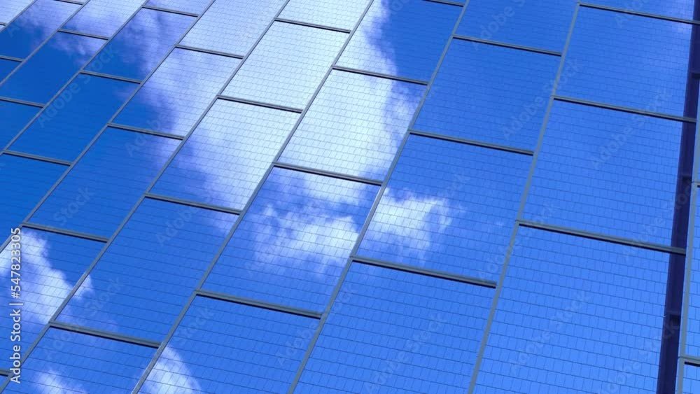 Close-up of the surface of blue photovoltaic solar panels, with beautiful sky time lapse reflection Production of renewable energy concept. Videos loop