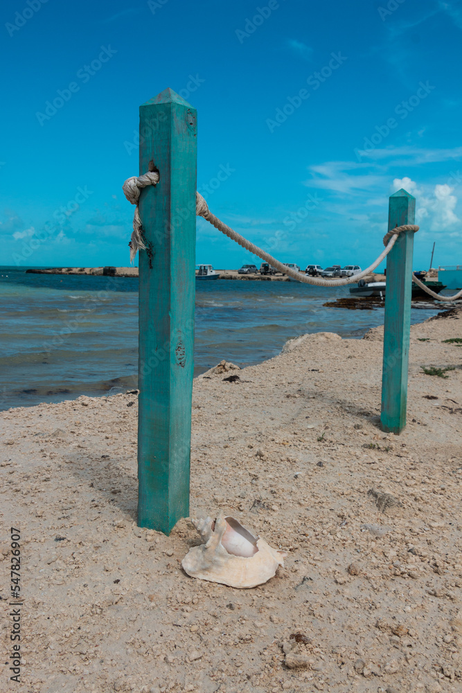 Rope Fence and Conch Shell Overlooking 5 Cays Beach Providenciales Turks and Caicos Rope Fence and Conch Shell Overlooking 5 Cays Beach Providenciales Turks and Caicos