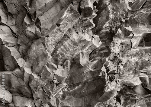 Intricate sculptural stone texture banner. Horizontal rock wall wallpaper.
