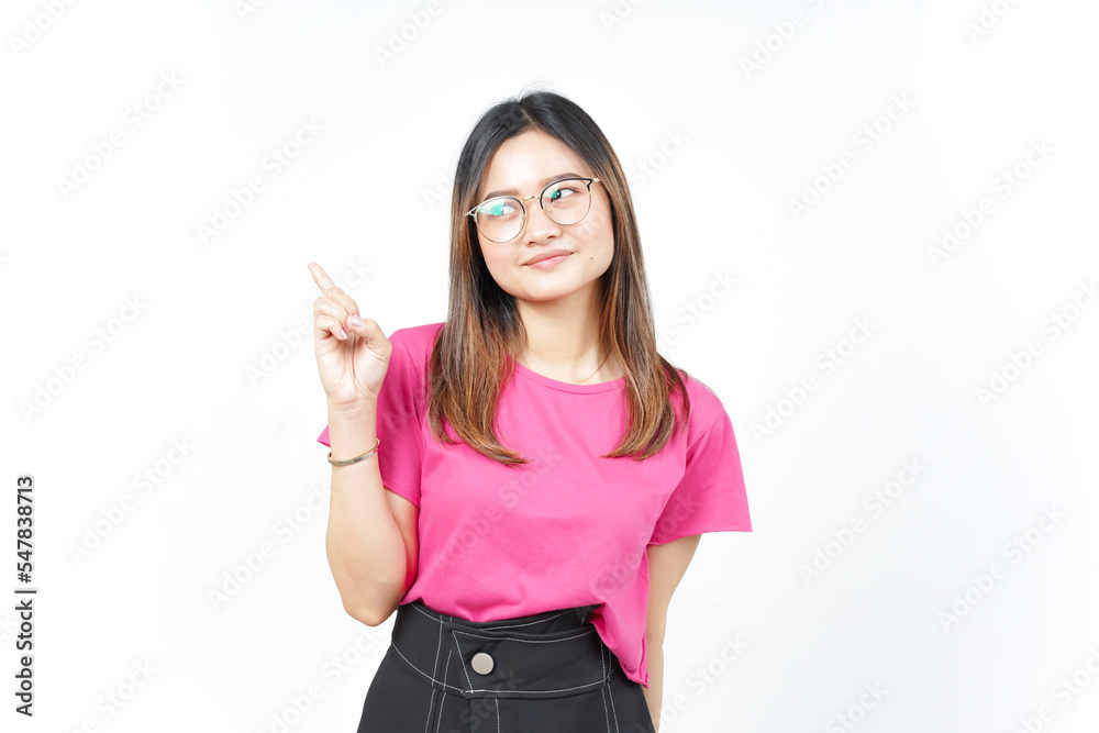 Obraz premium Showing Product and Pointing Side using forefinger Of Beautiful Asian Woman Isolated On White