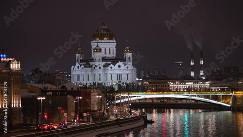 Winter night footage in Moscow, Russia. Zoom in view of landmarks of the city. Moving traffic at night