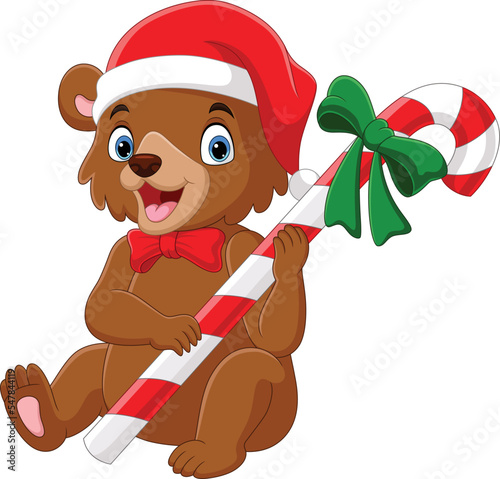Cartoon bear wearing scarf and hat holding candy cane