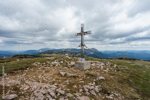 Summit cross on the Windberg near the Schneealpe in Styria, Austria photo
