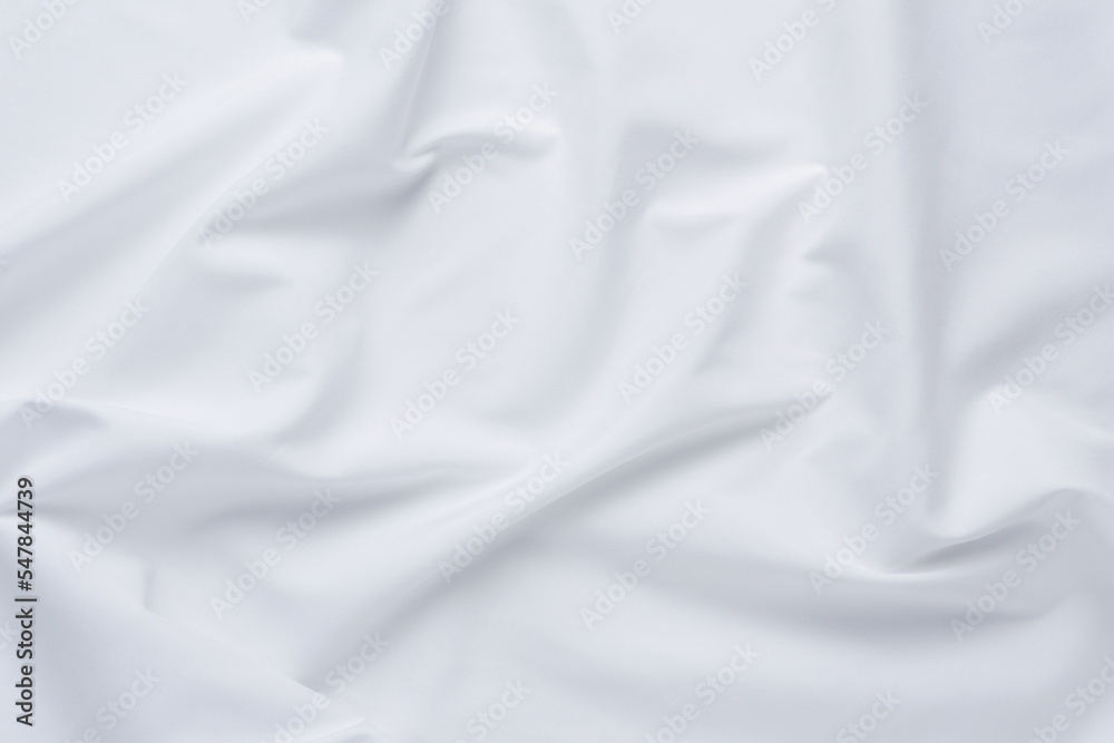 White fabric. luxurious white fabric texture background. Creases of satin, silk, and cotton.