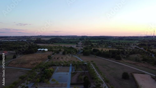 Federal horticultural show area nature. Magic aerial view flight panorama overview dronein Wismar farmland germany at sunset August 2022. 4k Cinematic photo