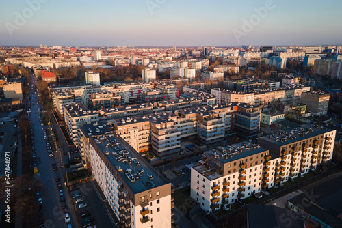 Modern residential complex in Wroclaw city, Poland. Aerial view of district with modern residence buildings, courtyards and parked cars.