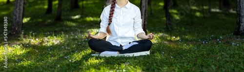 Panorama of woman relaxingly practicing meditation in the pine forest to attain happiness from inner peace wisdom for healthy mind and soul concept