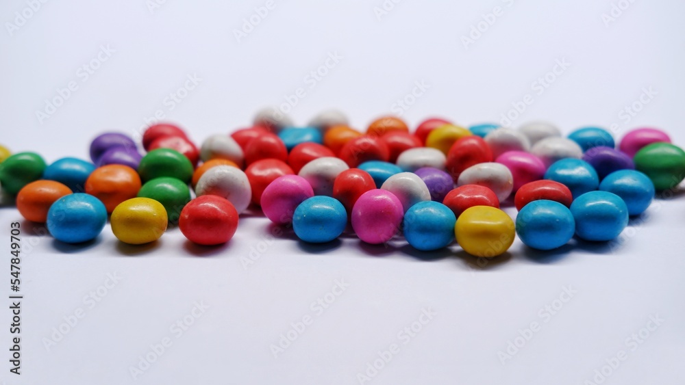 Marbles candy, Lollipops sweets. Candy, top view flat lay on white background. Sweet sucker, lollipop, candy, isolated minimal concept above decoration, food background Marbles candy, Lollipops sweets. Candy, top view flat lay on white background. Sweet sucker, lollipop, candy, isolated minimal concept above decoration, food background