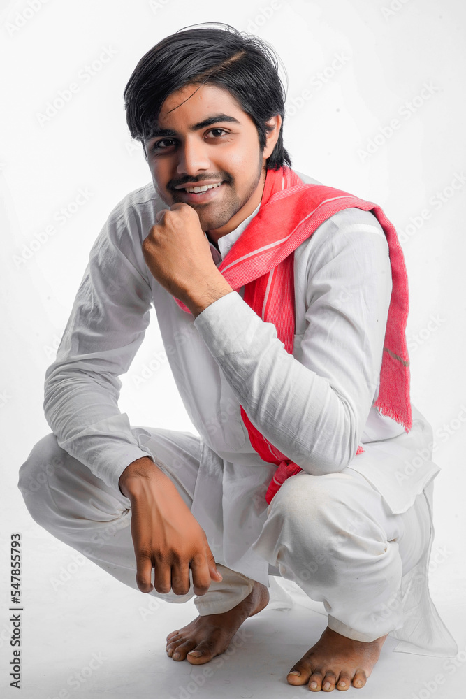 indian young farmer sitting on white background indian young farmer sitting on white background