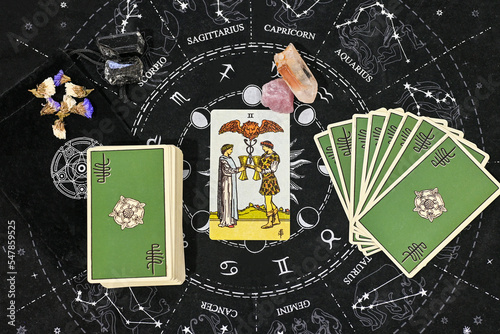 tarot spreading two of cups raider wait love reading tarot card in the middle with rose quartz and clear quartz on astrology zodiac sign constellation background
