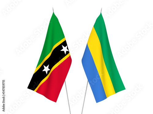 National fabric flags of Gabon and Federation of Saint Christopher and Nevis isolated on white background. 3d rendering illustration.