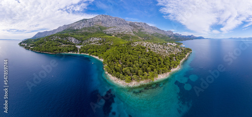 Fototapeta Naklejka Na Ścianę i Meble -  Duba plaza nearby Igrane village on Makarska riviera and Biokovo mountain aerial view, Dalmatia region of Croatia