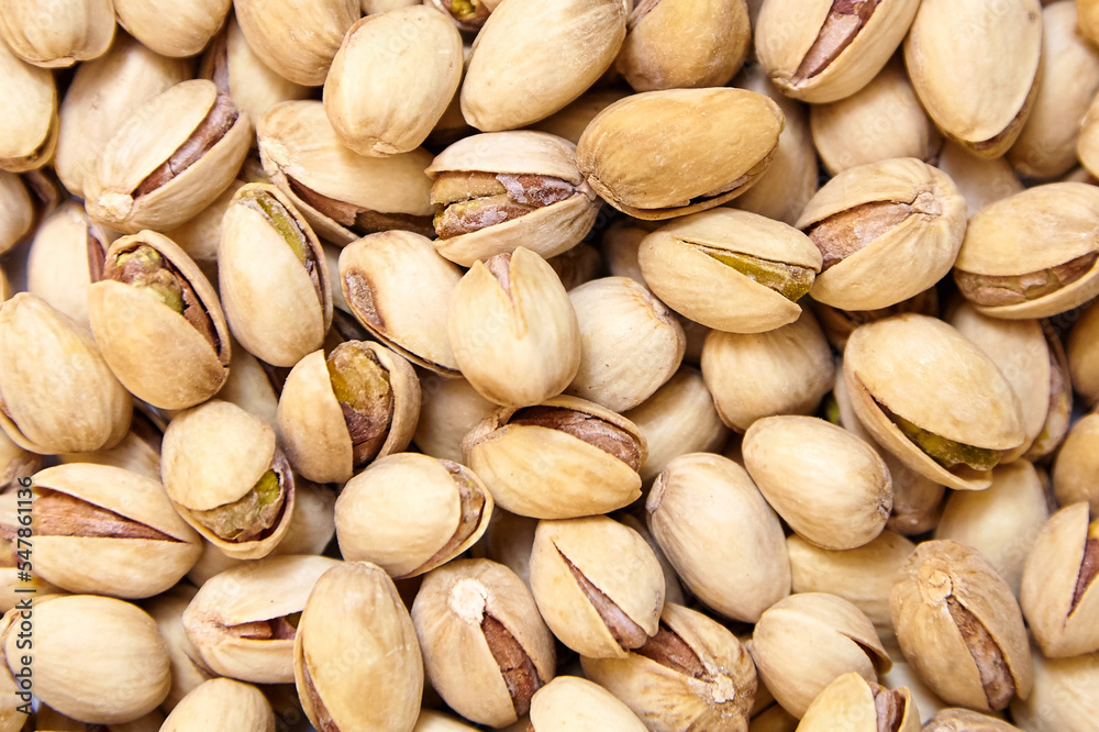 Pistachios texture and background. Pistachio nuts, top view, flat lay