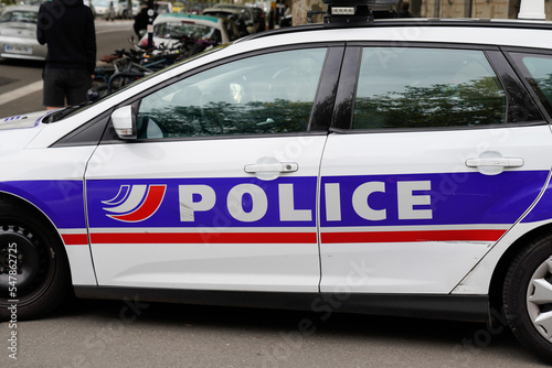 police car with text sign and symbol logo of French national police parked in city street