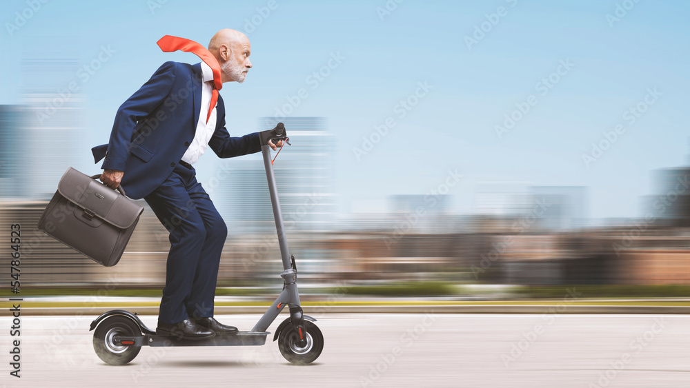 Corporate businessman riding a scooter - obrazy, fototapety, plakaty 