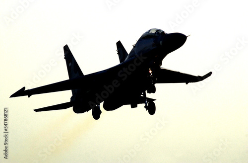 Silhouette image of a Sukhoi super jet fighter taking off in an exercise
