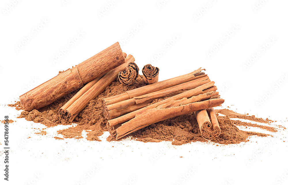 Pile of ground cinnamon and ceylon cinnamon sticks isolated on a white background - obrazy, fototapety, plakaty 