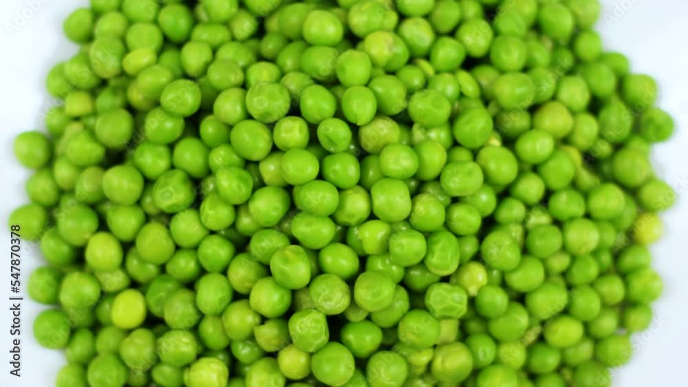 Close Up Green Peas Background Rotating. Macro Shot Fresh Organic Green Peas. Vegetable Harvest Healthy Eating. Beautiful Texture Close-up of Fresh Green Peas. Healthy Vegetarian food. Close Up Green Peas Background Rotating. Macro Shot Fresh Organic Green Peas. Vegetable Harvest Healthy Eating. Beautiful Texture Close-up of Fresh Green Peas. Healthy Vegetarian food.