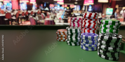 Poker chips stacks on green felt roulette table, blur casino interior background. 3d