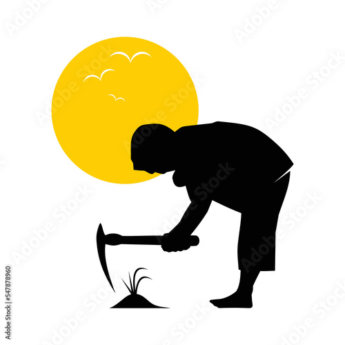 Gardener holding hoe and dig soil for planting tree.