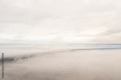 Aerial top view white clouds. View from drone. Aerial top view cloudscape. Texture of clouds. View from above. Panorama sky