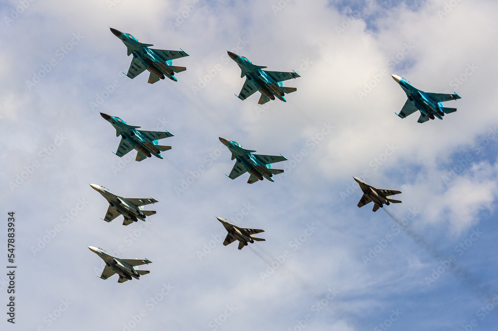 Formation flight of front-line supersonic fighter-bombers of fourth generation Su-34 (Fullback) and Su-35 (NATO - Flanker-E). 100 years of the Russian Air Force. Zhukovsky, Russia, August 10, 2012 Formation flight of front-line supersonic fighter-bombers of fourth generation Su-34 (Fullback) and Su-35 (NATO - Flanker-E). 100 years of the Russian Air Force. Zhukovsky, Russia, August 10, 2012