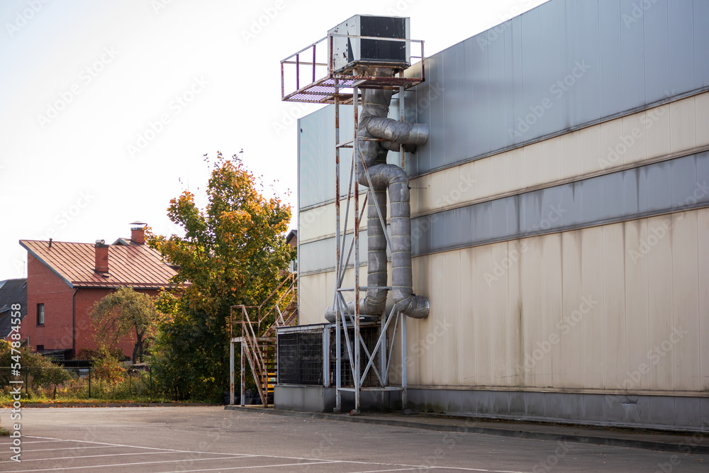 Ventilation pipes of an industrial building on the exterior wall of a ... - Exposed Ventilation Pipes In Industrial Style Penthouse