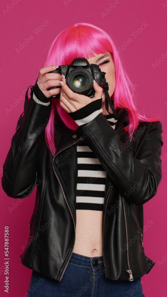Vertical video: Young beautiful woman working with dslr camera as photographer, using device to take pictures and have fun. Pretty joyful person being carefree and capturing images, photography Vertical video: Young beautiful woman working with dslr camera as photographer, using device to take pictures and have fun. Pretty joyful person being carefree and capturing images, photography