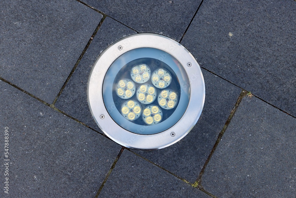 LED lamp with 7 lights installed in ground on a walkway
