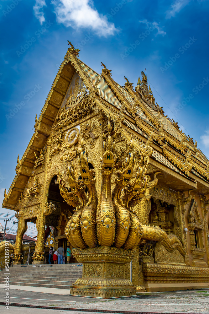 Close-up golden statue in Thai temple 