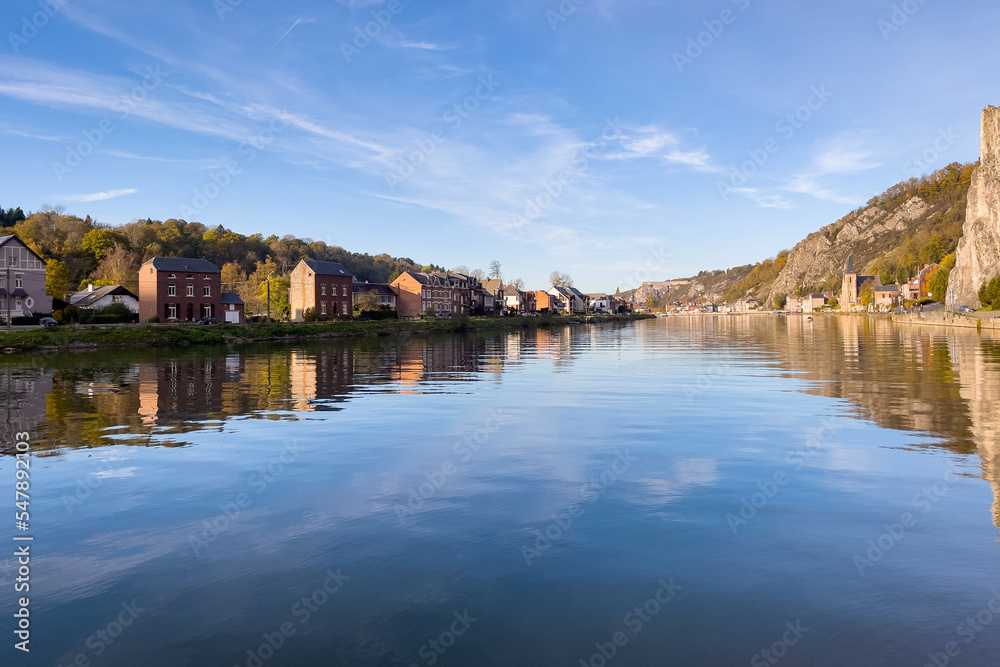 Rocher Bayard with its reflection on the Meuse river in Dinant, Belgium