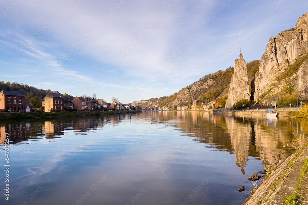 Rocher Bayard with its reflection on the Meuse river in Dinant, Belgium